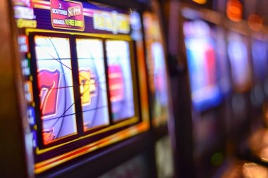 Ganesha Gold slot game interface with five reels and paytable